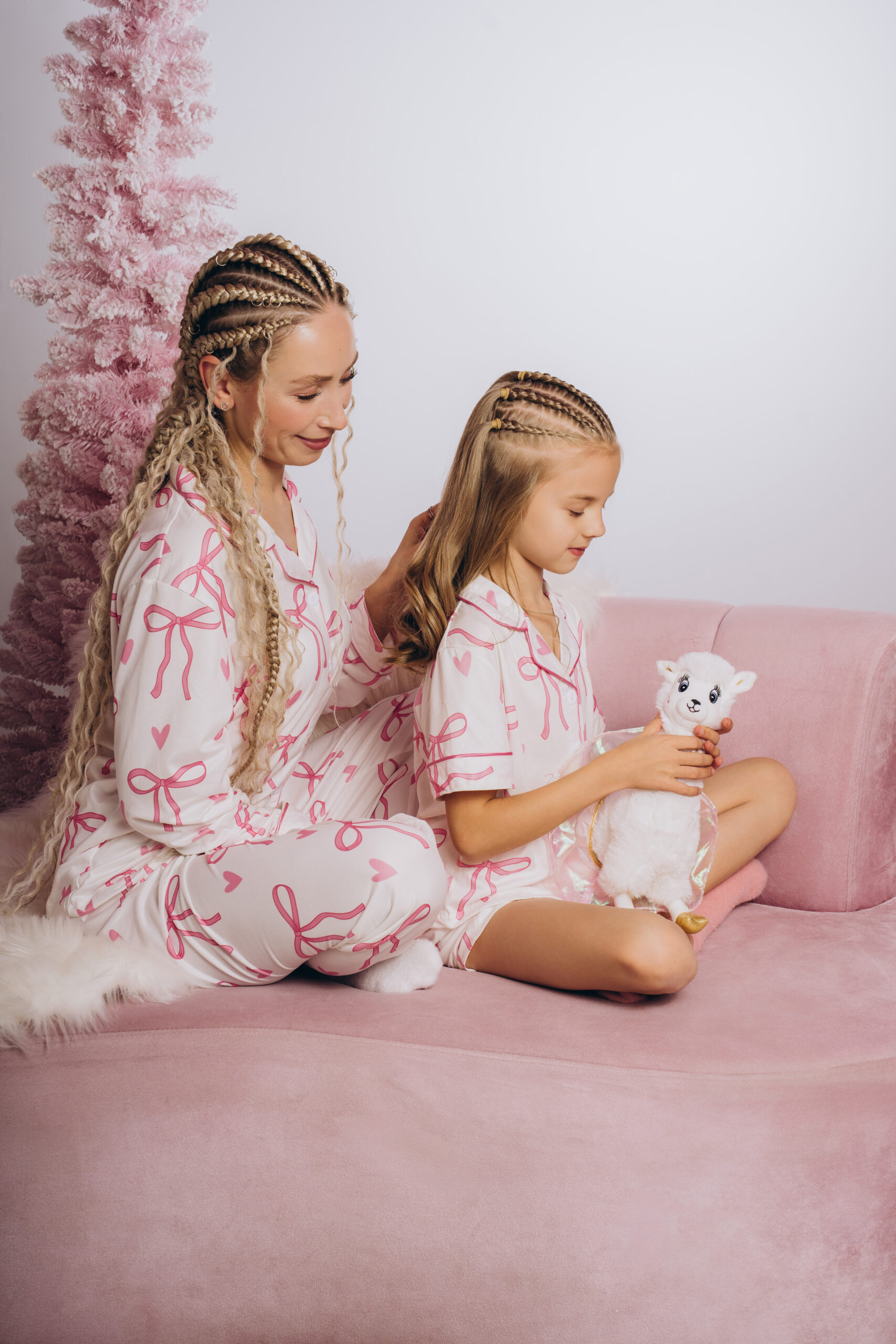 mom braiding daughter's hair